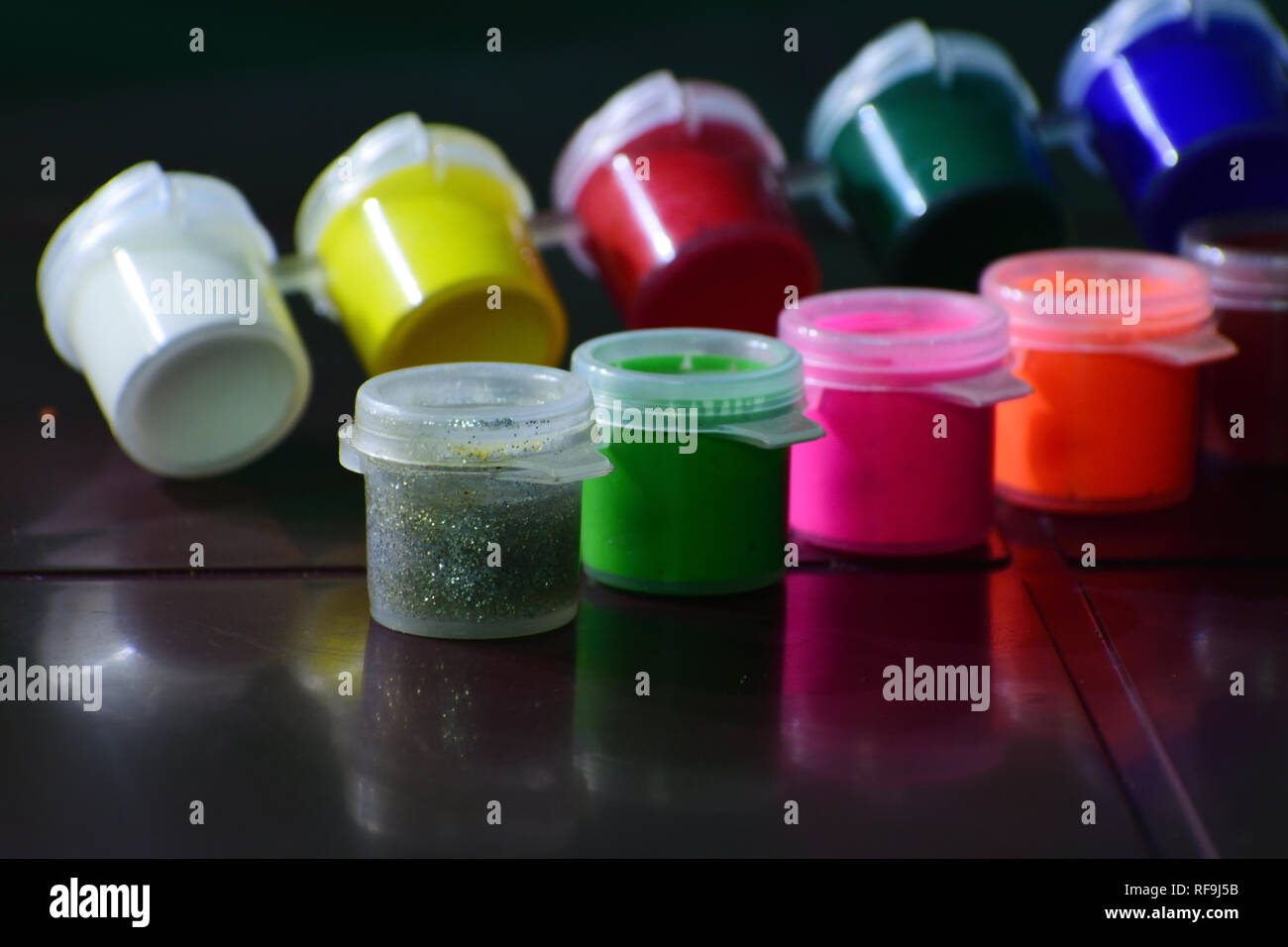 Multi color paint containers Stock Photo - Alamy