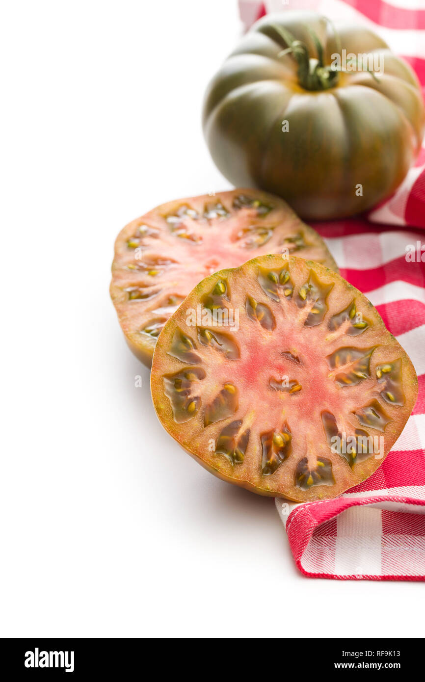 Dark brandywine tomatoes isolated on white background. Stock Photo