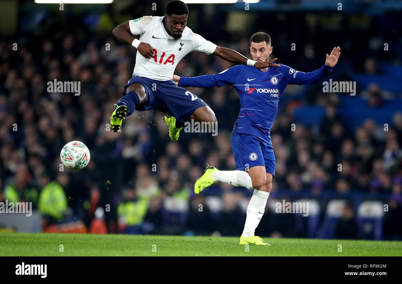 Tottenham Hotspur's Serge Aurier (left) and Chelsea's Eden Hazard (right) battle for the ball during the Carabao Cup Semi Final, second leg match at Stamford Bridge, London. Stock Photo