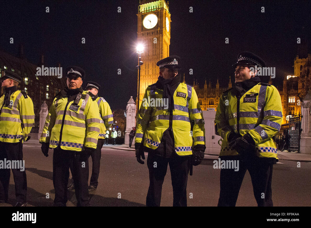 Police officers outside Big Ben and The Houses of Parliament in London ...