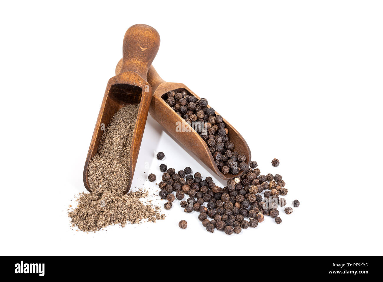 Black pepper seeds and Black pepper ground isolated on white background. Copy space. Piper nigrum Stock Photo