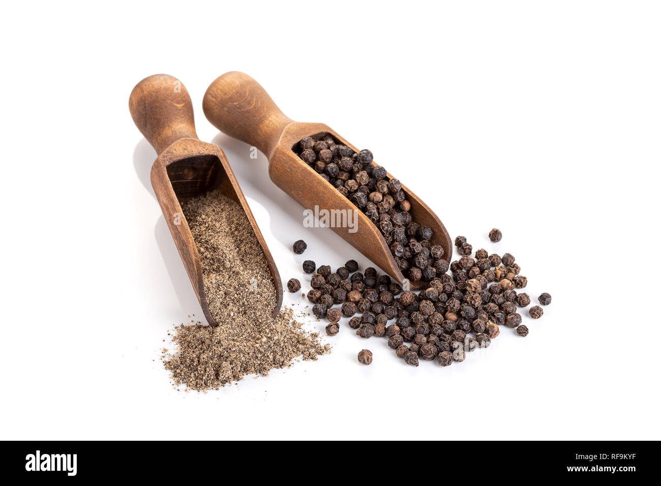 Black pepper seeds and Black pepper ground isolated on white background. Copy space. Piper nigrum Stock Photo