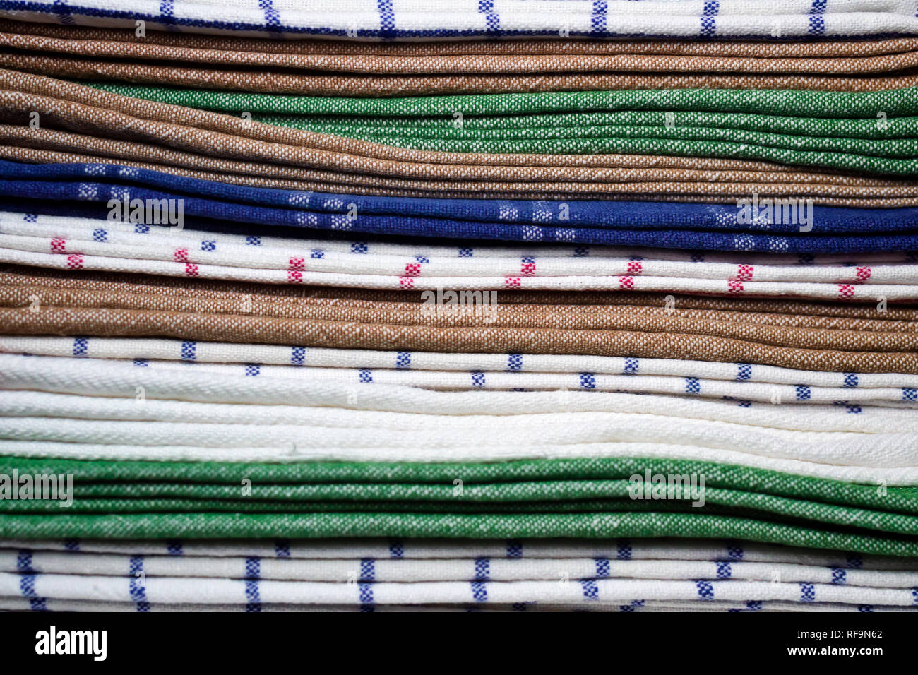 stack of mixed cotton kitchen towels Stock Photo