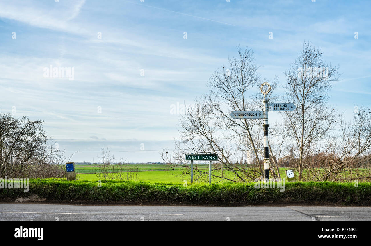 Old fashoned signposts in the town of Crowland, Lincolnshire, England on a sunny winter day Stock Photo