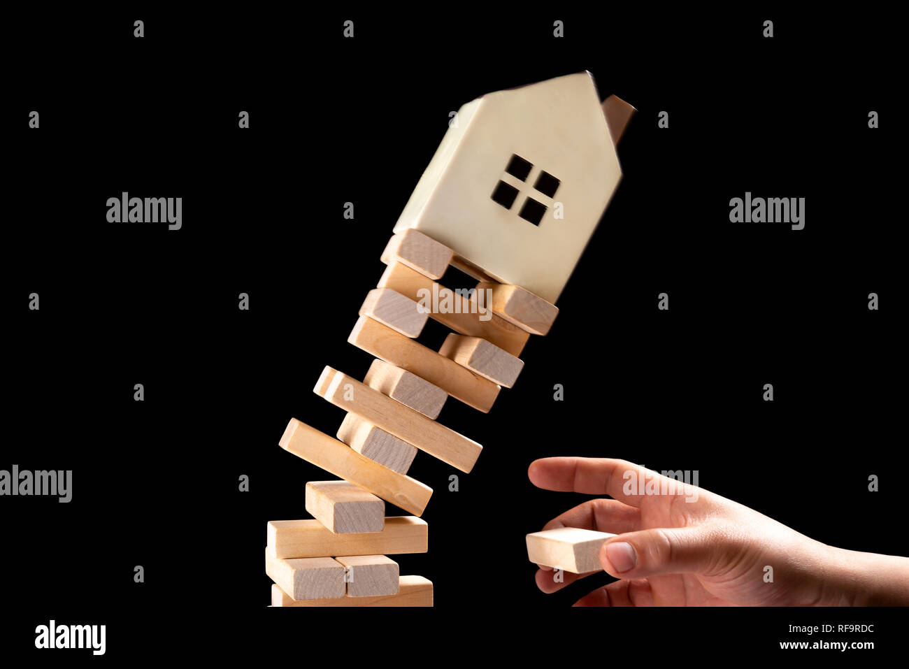 house falling down from a unstable base concept of real estate