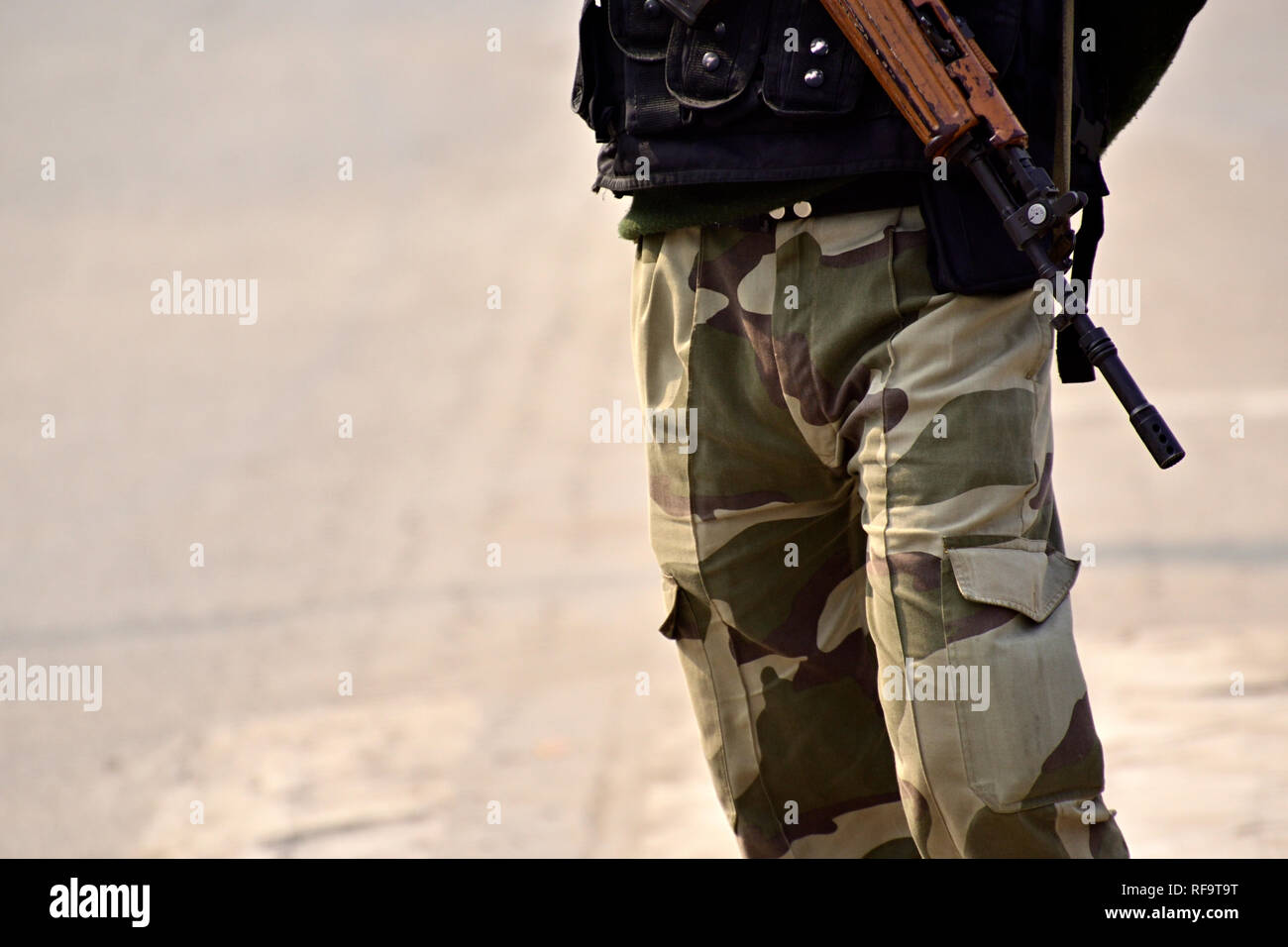 Security guard with rifle standing on outside to protect the area Stock ...