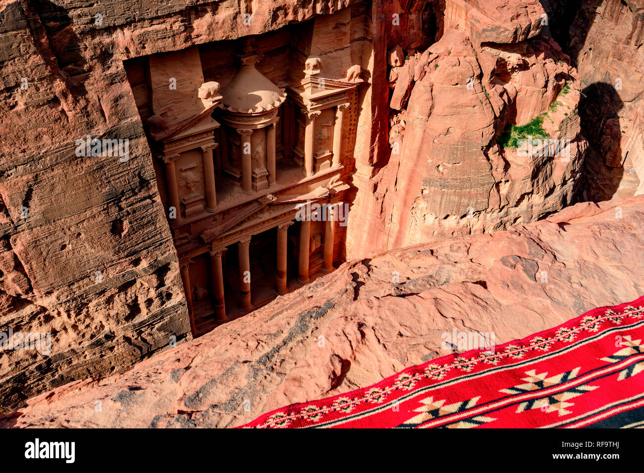 Spectacular view from above of Al Khazneh (The Treasury) in Petra during a sunny day. Stock Photo