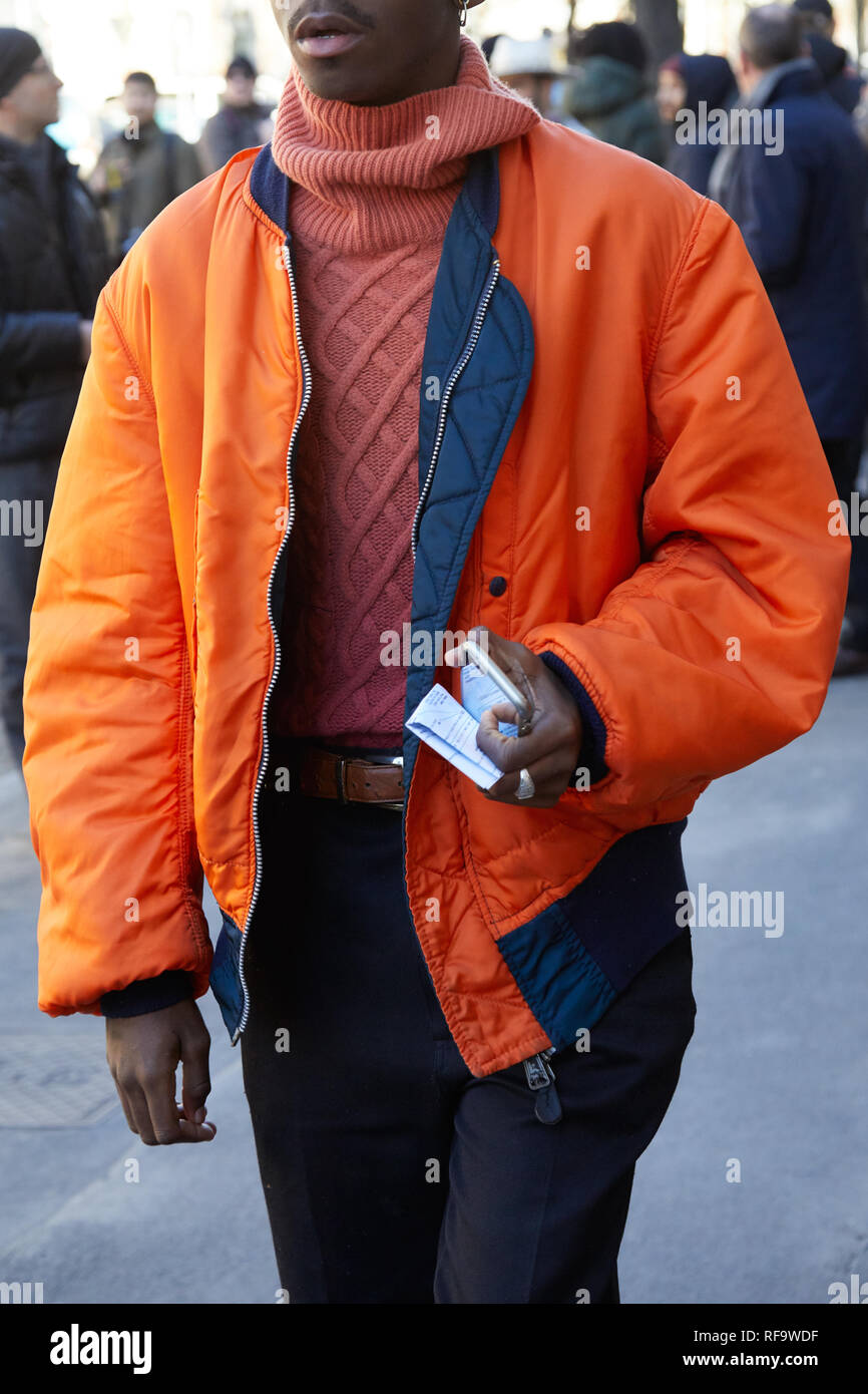 MILAN - JANUARY 15: Man with orange shirt and red Louis Vuitton Supreme bag  looking at phone before Represent fashion show, Milan Fashion Week street  Stock Photo - Alamy
