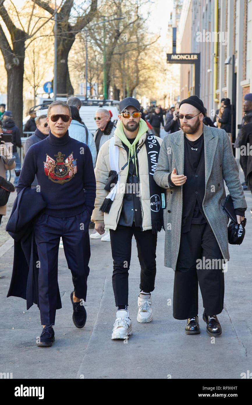 MILAN, ITALY - JANUARY 14, 2019: Men walking before Fendi fashion show, Milan Fashion Week street style Stock Photo