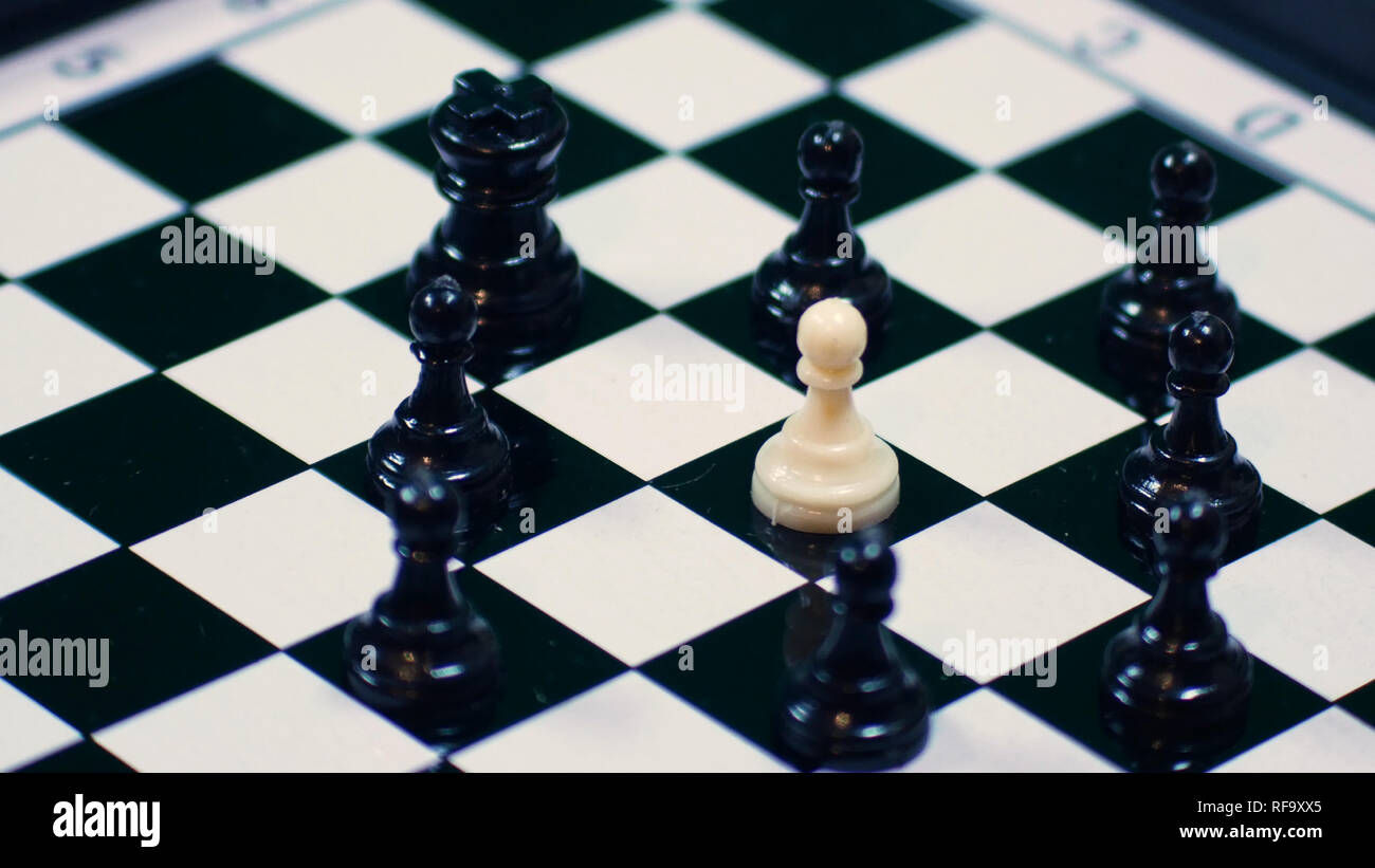 White Chess King Among Lying Down Black Pawns On Chessboard High-Res Stock  Photo - Getty Images