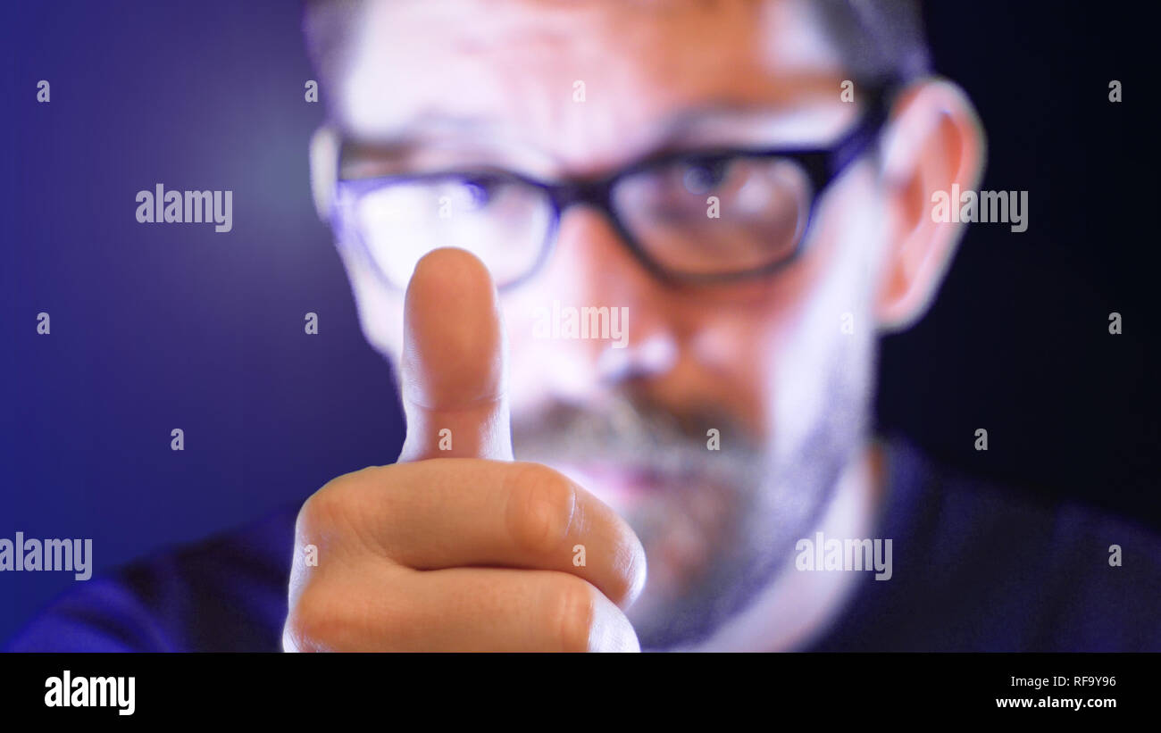 man with a blurred face makes a thumb up, positive, footage represents feelings like positivita, ok, justice, optimismv Stock Photo