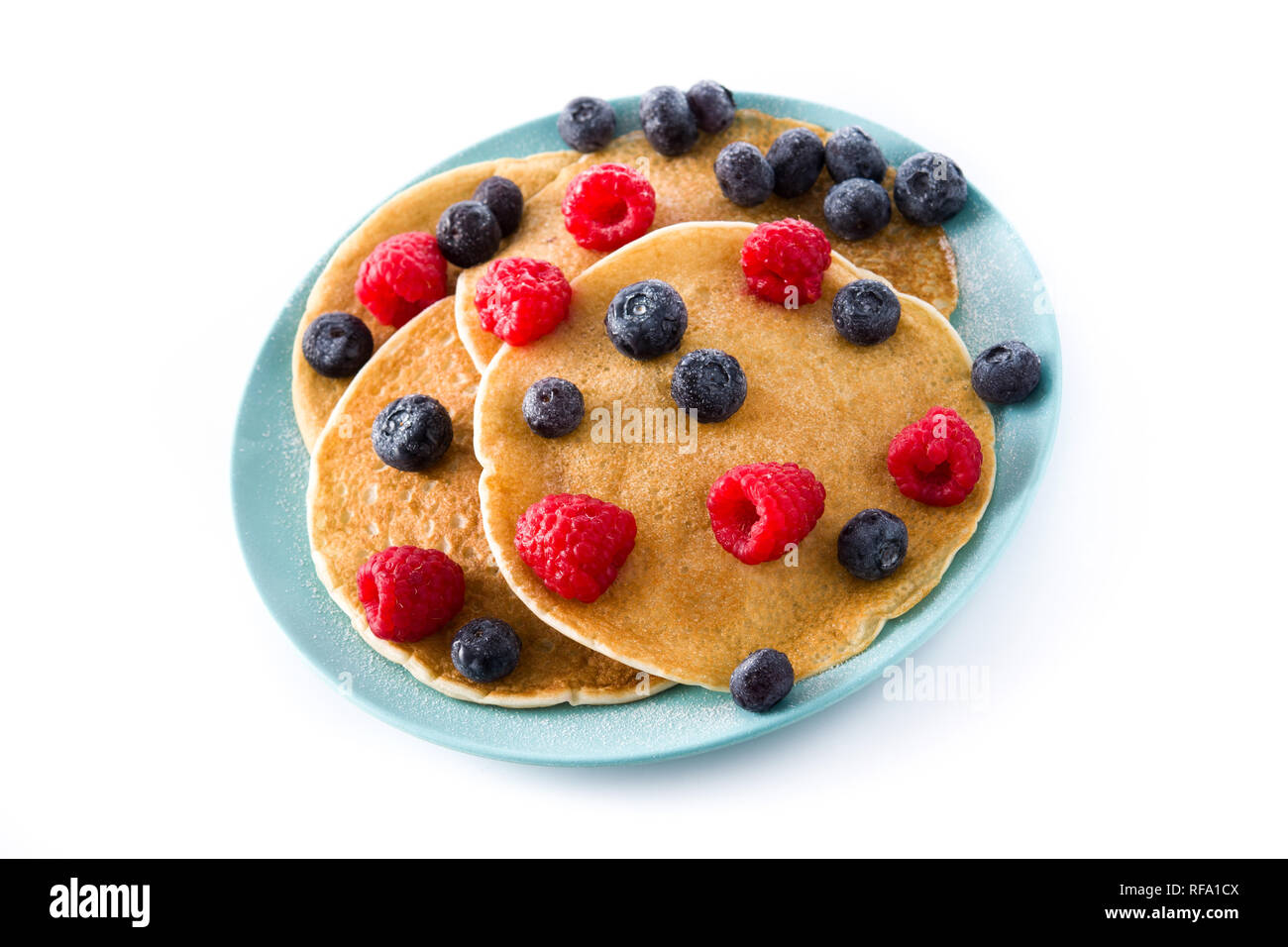 Pancakes with raspberries and blueberries isolated on white background ...