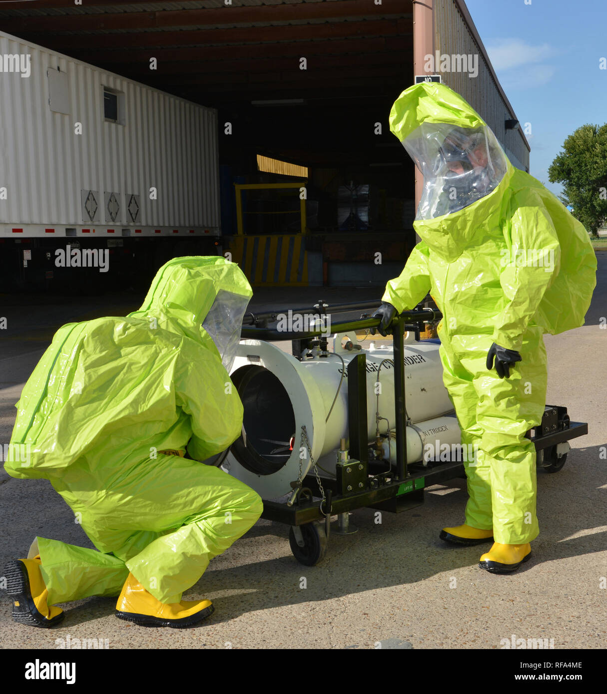 Hazardous materials technicians disposing of toxic material Stock Photo