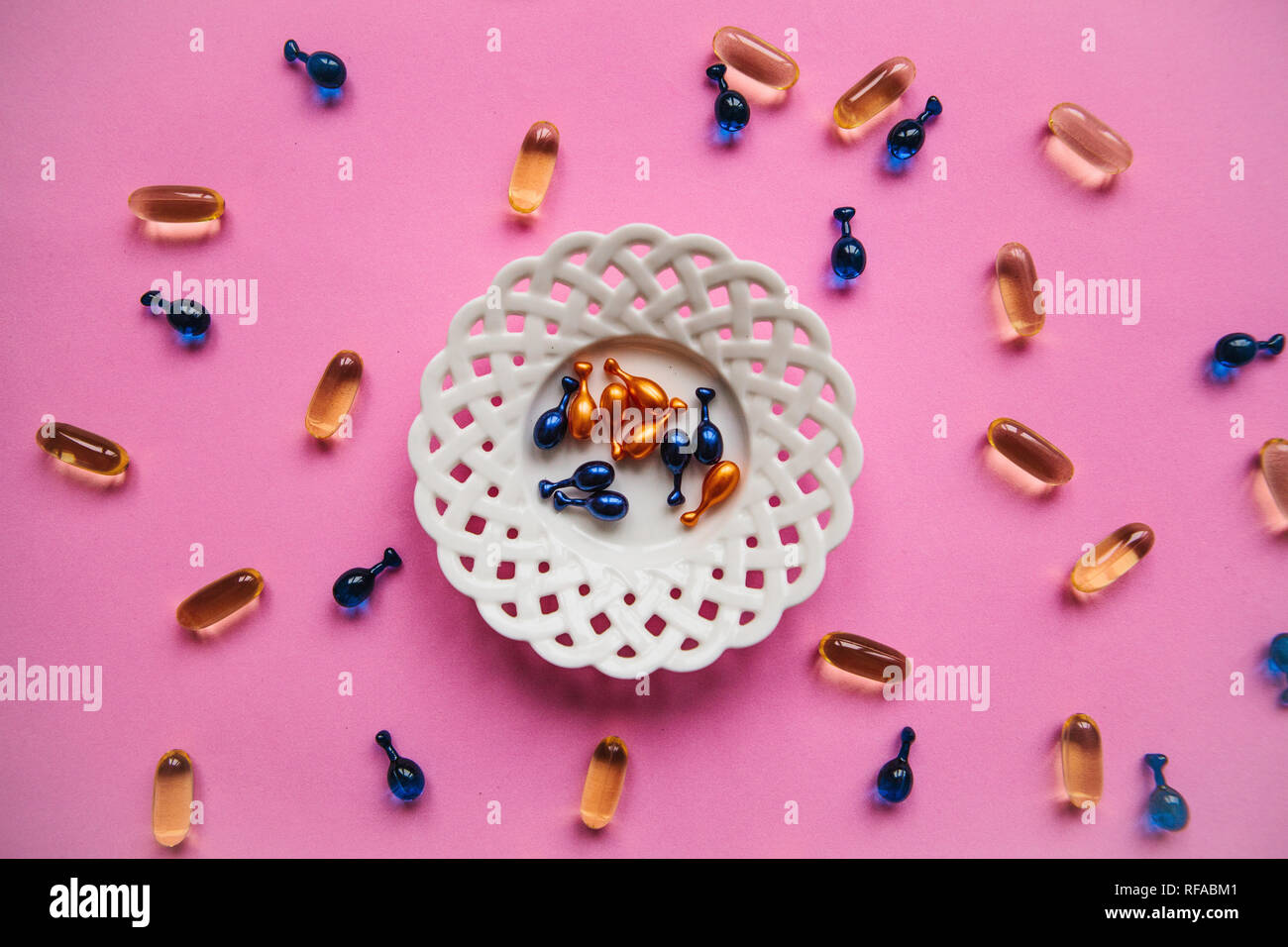 Capsule background with Omega 3, hyaluronic acid and coenzyme. Caring