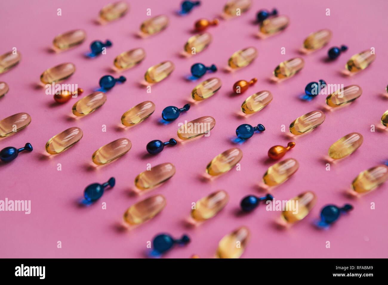 Capsule background with Omega 3, hyaluronic acid and coenzyme. Caring