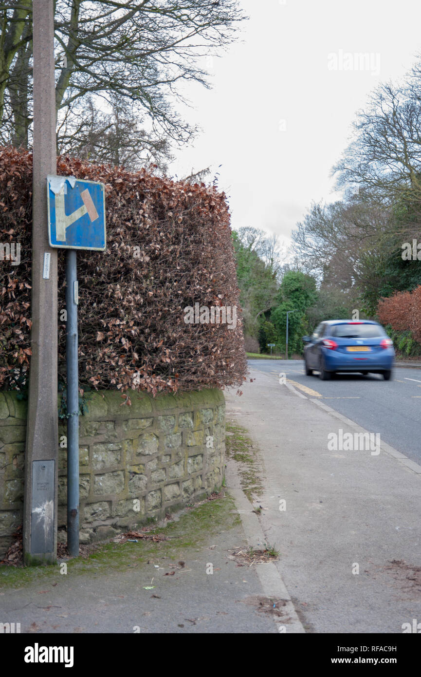 Traffic in a rural English Village Stock Photo