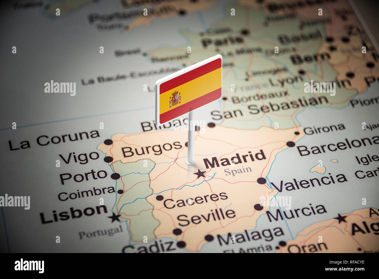 spain marked with a flag on the map Stock Photo