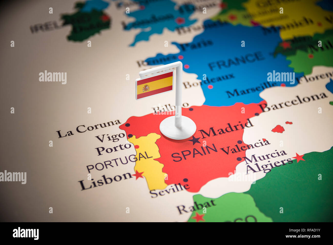 spain marked with a flag on the map Stock Photo