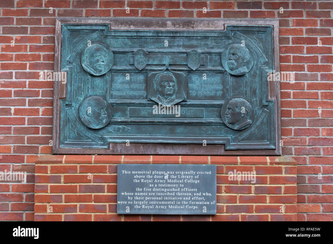 Memorial plaque to 5 members of the Royal Army Medical Corps on the exterior wall of the Museum of Military Medicine, Keogh Barracks, Surrey, UK Stock Photo