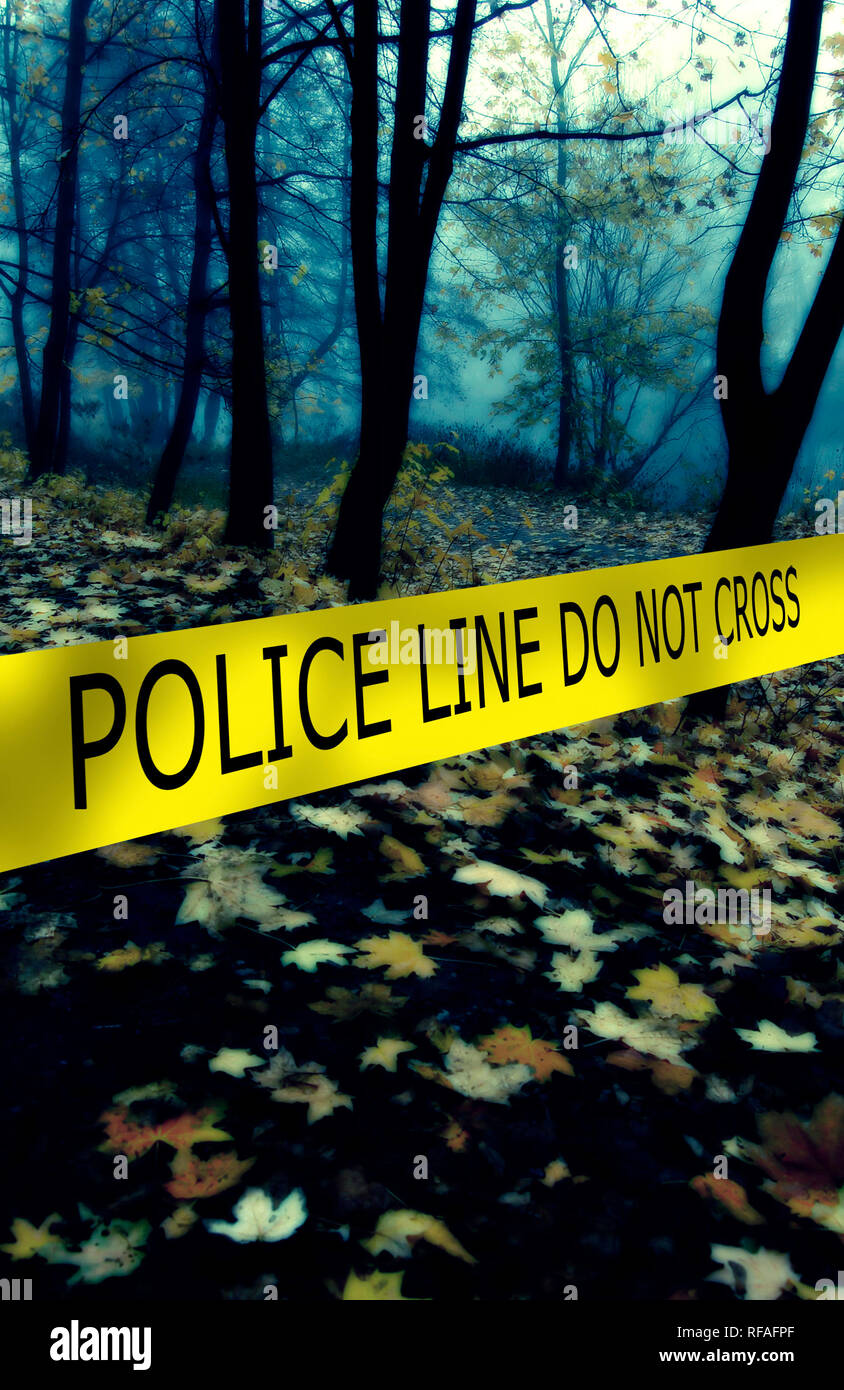 crime scene delimited with yellow tape in a cold morning in the forest
