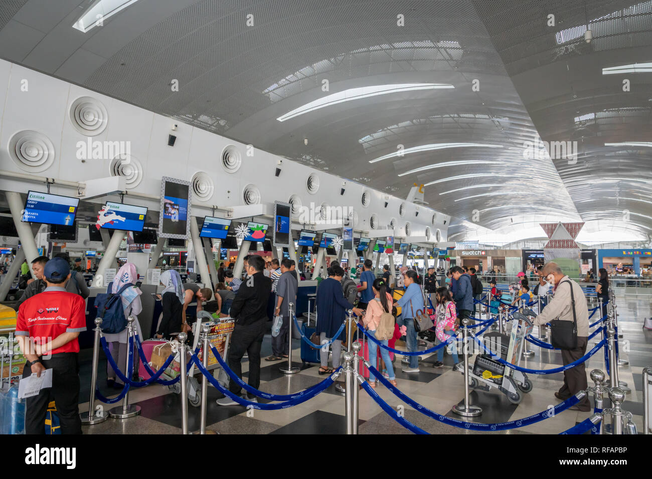Medan, Indonesia - January 2019: Passengers at Kualanamu international airport check-in counter in Medan, North Sumatra, Indonesia. Stock Photo