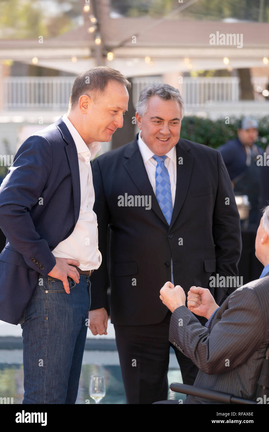 Joe Hockey, center, Australian ambassador to the United States, and Austin, Texas, businessman James Messer, left, visit with Texas Gov. Greg Abbott during the Great Mates Australia-Texas Barbecue at the Governor's Mansion in Austin. Abbott and Hockey worked to strengthen ties between the allies discussing agriculture and high tech before eating Australian Vegemite burnt ends and HeartBrand Akaushi beef. Stock Photo
