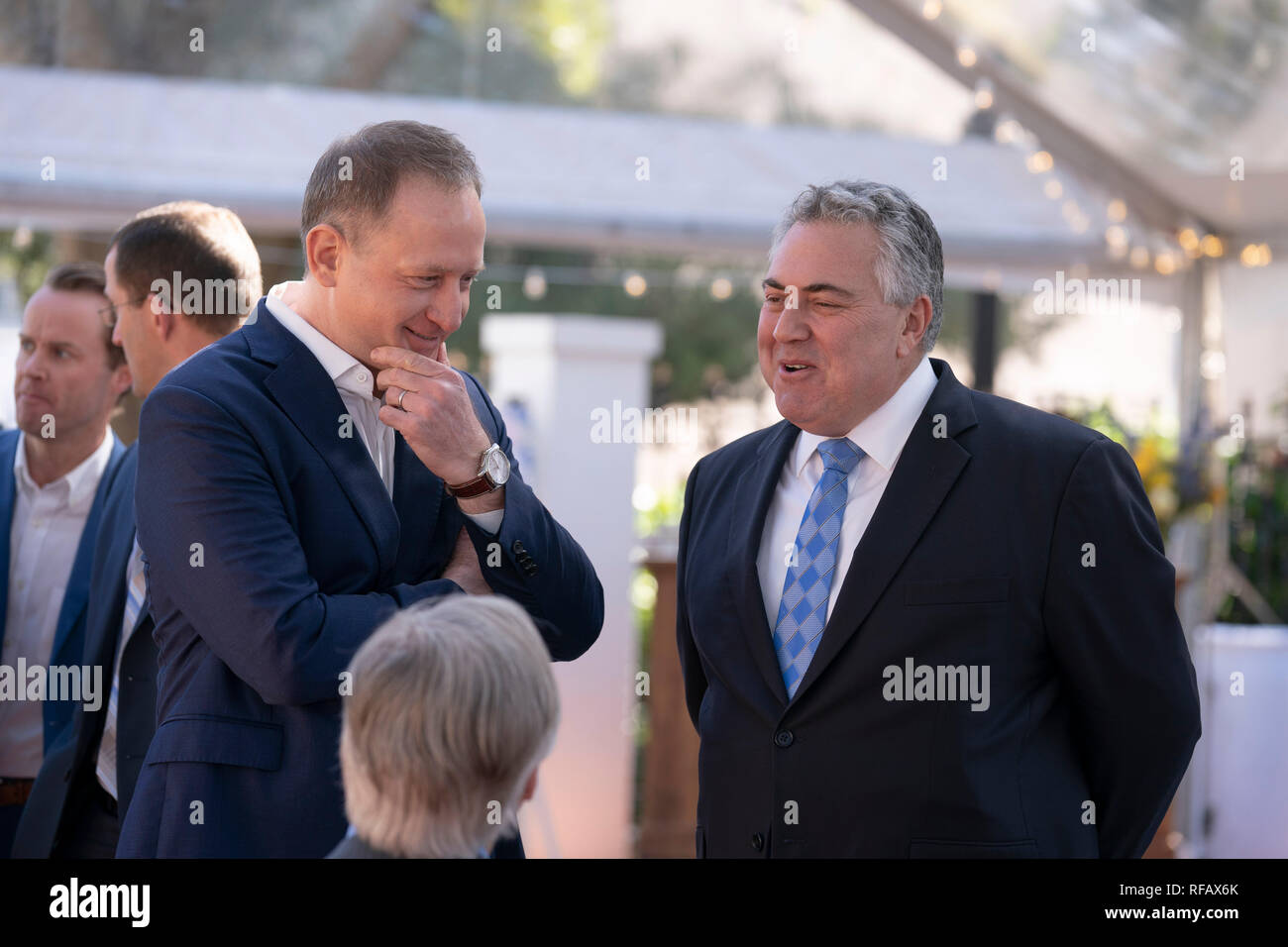 Joe Hockey, center, Australian ambassador to the United States, and Austin, Texas, businessman James Messer, left, visit with Texas Gov. Greg Abbott during the Great Mates Australia-Texas Barbecue at the Governor's Mansion in Austin. Abbott and Hockey worked to strengthen ties between the allies discussing agriculture and high tech before eating Australian Vegemite burnt ends and HeartBrand Akaushi beef. Stock Photo