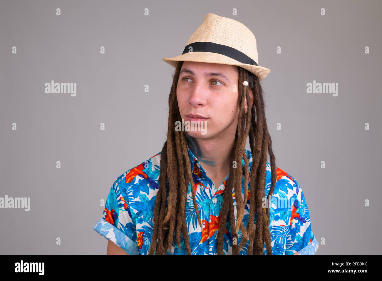 Face of young handsome tourist man with 