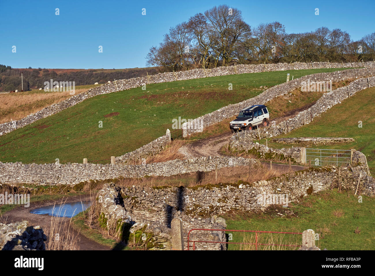 Land Rover on Tideswell Lane, a Green Lane near Eyam. Peak District National Park, Derbyshire, England. Stock Photo