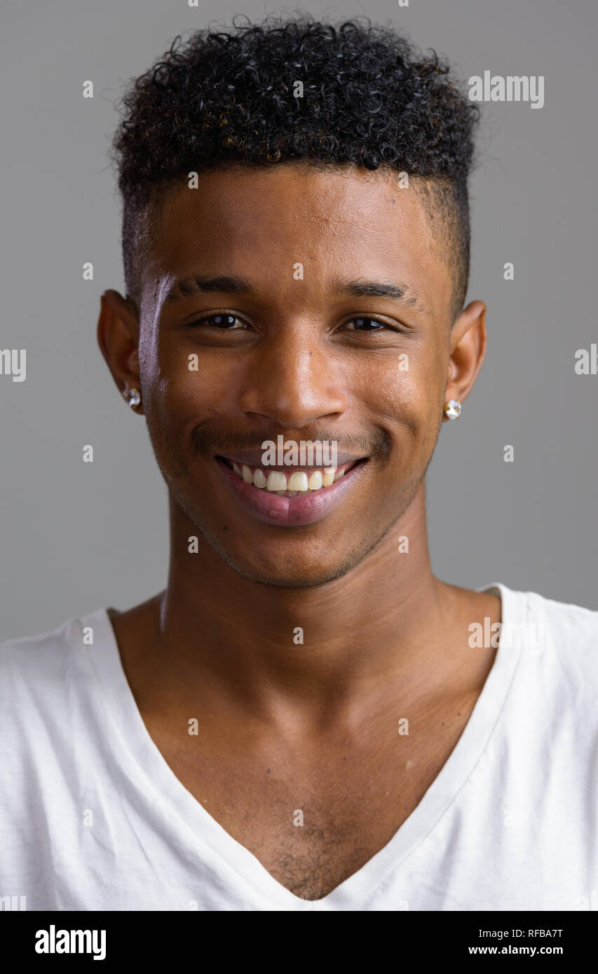 Face of young happy African man looking at camera Stock Photo - Alamy