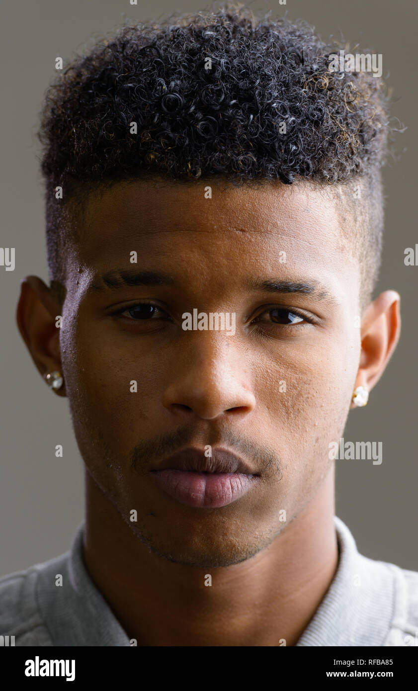 Face of young handsome African man looking at camera Stock Photo - Alamy
