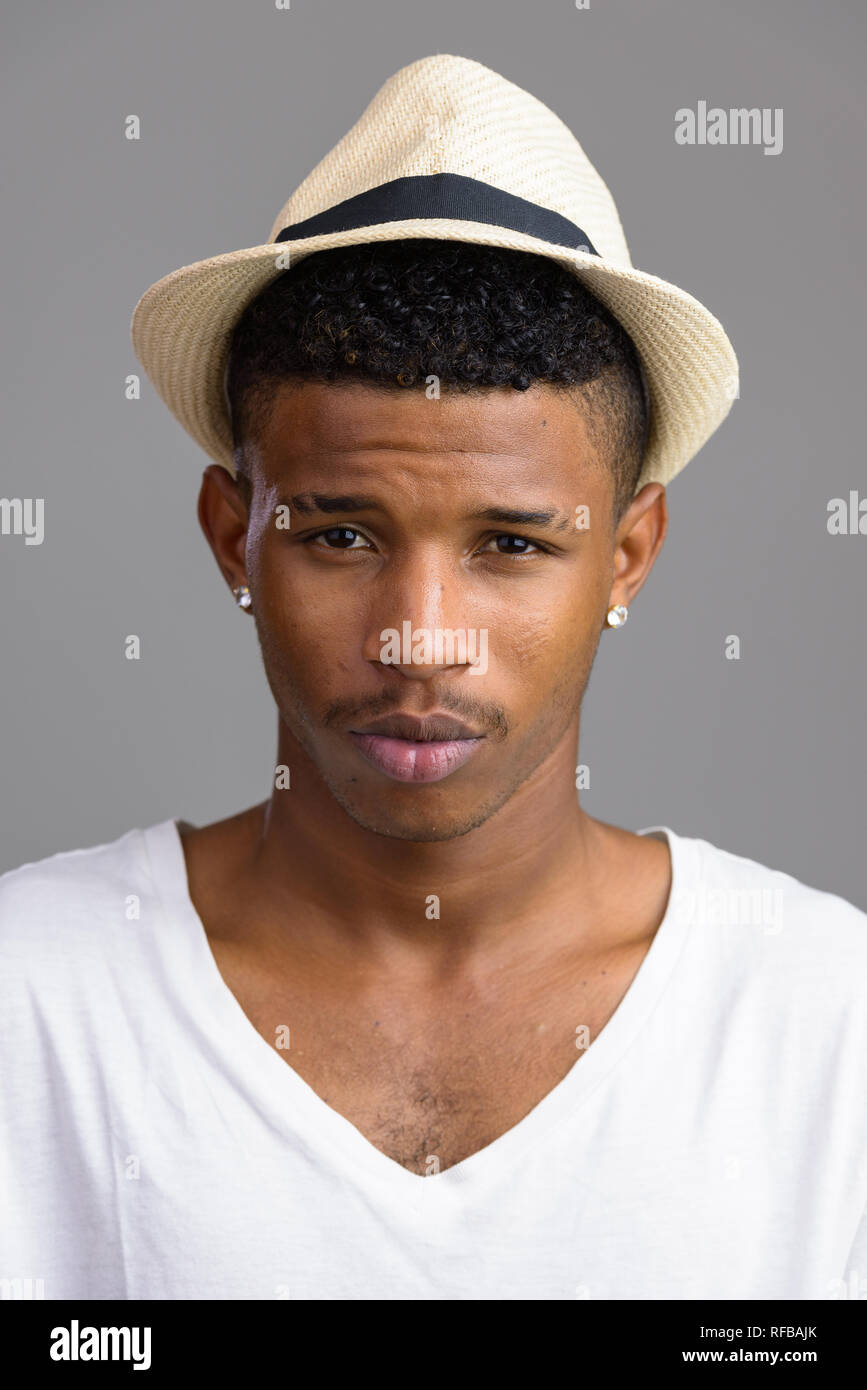 Face of young handsome African man looking at camera Stock Photo - Alamy