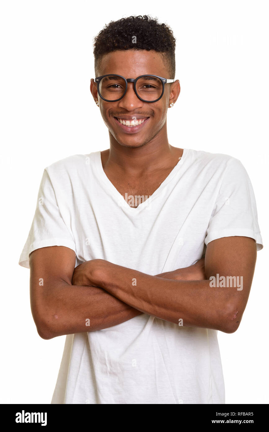 Young happy African man smiling with arms crossed Stock Photo - Alamy