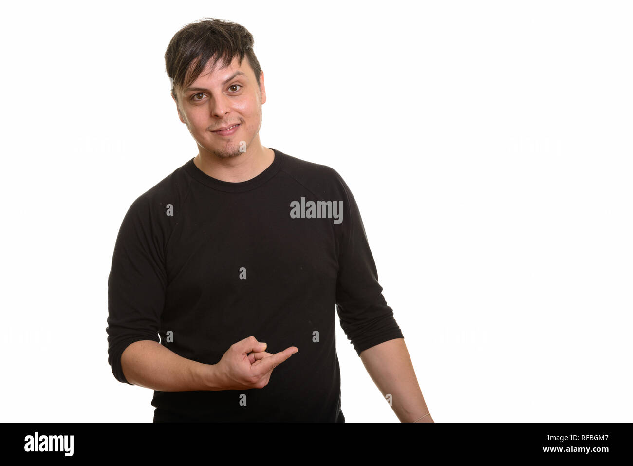 Studio shot of Caucasian man pointing finger Stock Photo