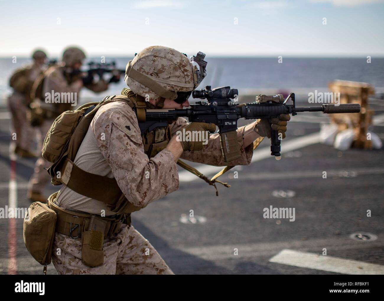 MEDITERRANEAN SEA (Jan. 21, 2019) Marines with the Battalion Landing Team, 1st Battalion, 2nd Marine Regiment, 22nd Marine Expeditionary Unit, practice immediate action drills on the flight-deck of the USS Arlington (LPD 24) during a live-fire deck shoot while deployed in the Mediterranean Sea, Jan. 21, 2019. The USS Arlington is making a scheduled deployment as part of the 22nd MEU and the Kearsarge Amphibious Ready Group, in support of maritime security operations, crisis response and theatre security cooperation, while also providing a forward Naval and Marine presence. (U.S. Marine Corps p Stock Photo