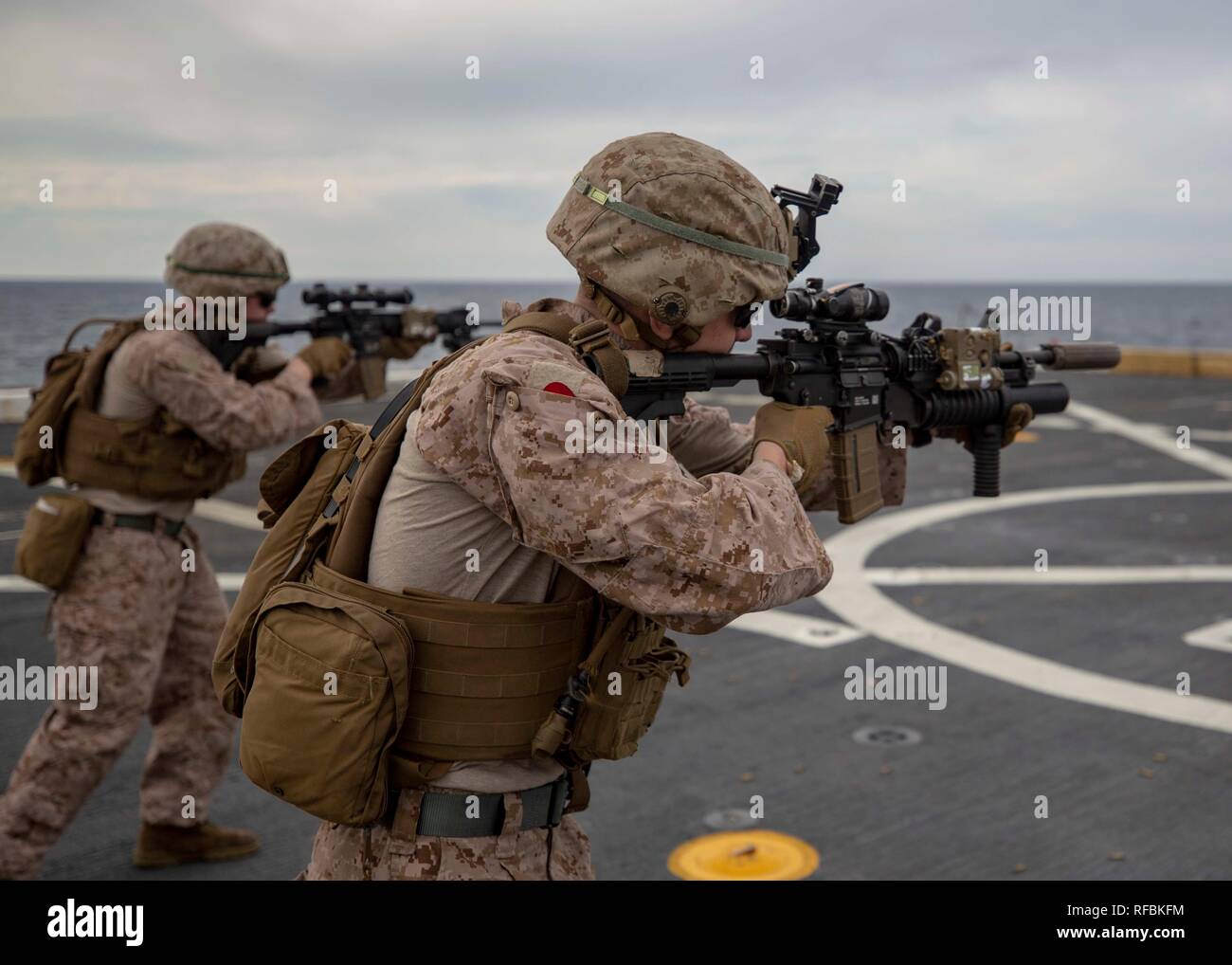 MEDITERRANEAN SEA (Jan. 21, 2019) Marines with the Battalion Landing Team, 1st Battalion, 2nd Marine Regiment, 22nd Marine Expeditionary Unit, practice immediate action drills on the flight-deck of the USS Arlington (LPD 24) during a live-fire deck shoot while deployed in the Mediterranean Sea, Jan. 21, 2019. The USS Arlington is making a scheduled deployment as part of the 22nd MEU and the Kearsarge Amphibious Ready Group, in support of maritime security operations, crisis response and theatre security cooperation, while also providing a forward Naval and Marine presence. (U.S. Marine Corps p Stock Photo