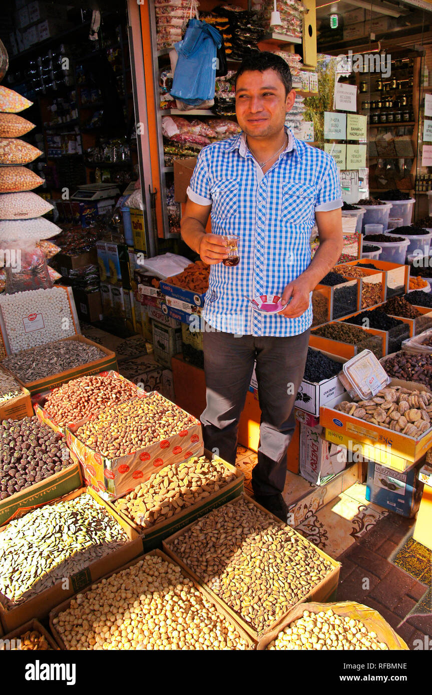 Having tea on a dry fruits stand at Konya. Anatolia, Turkey Stock Photo