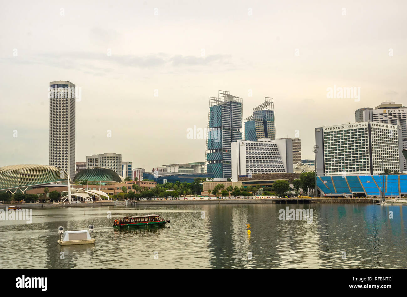 Singapore, Southeast Asia - December 15, 2018: Vibrant panorama background of Singapore skyline modern urban buildings on business district bay. Stock Photo