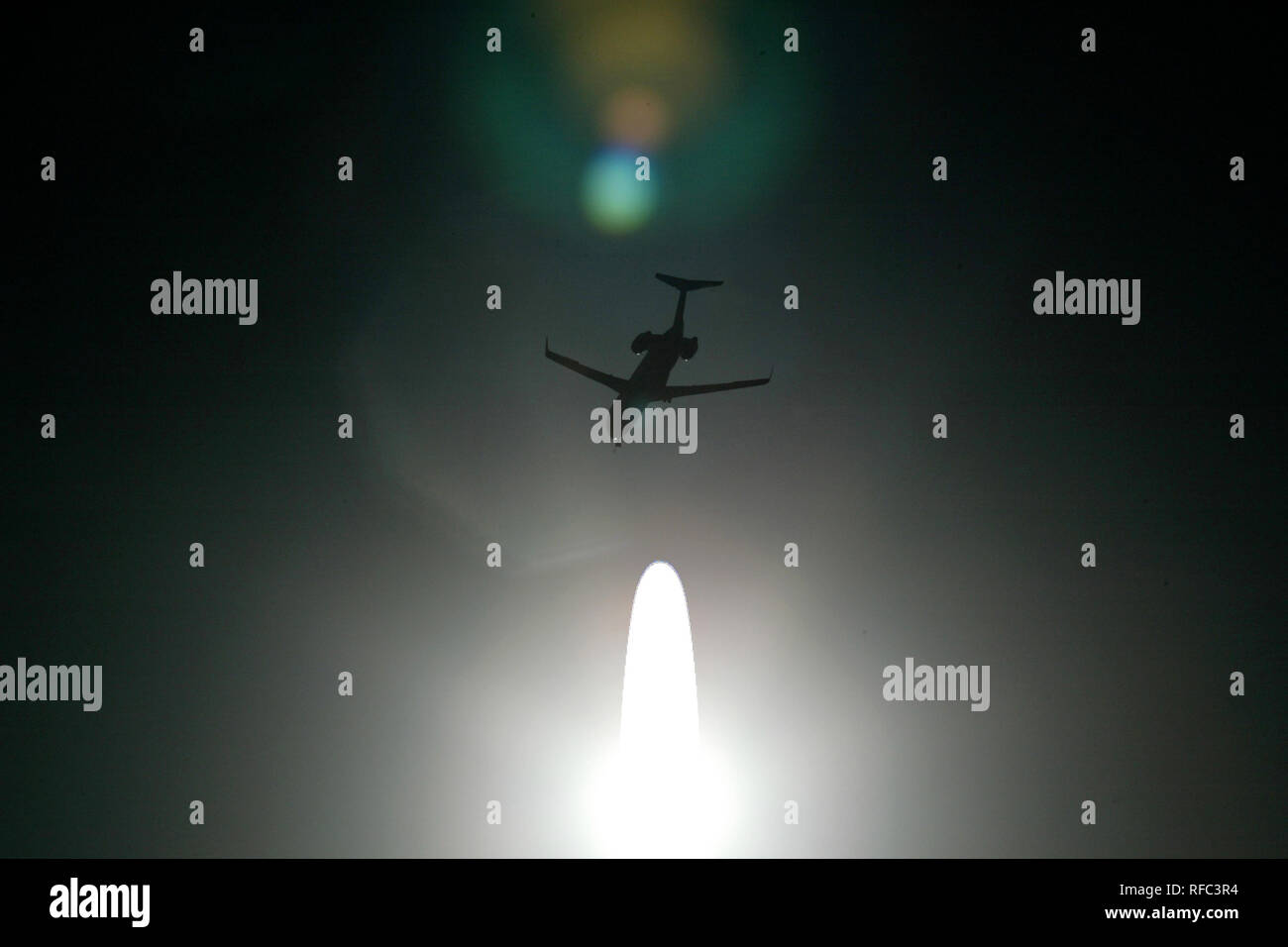 An airplane flies in the sky Stock Photo Alamy