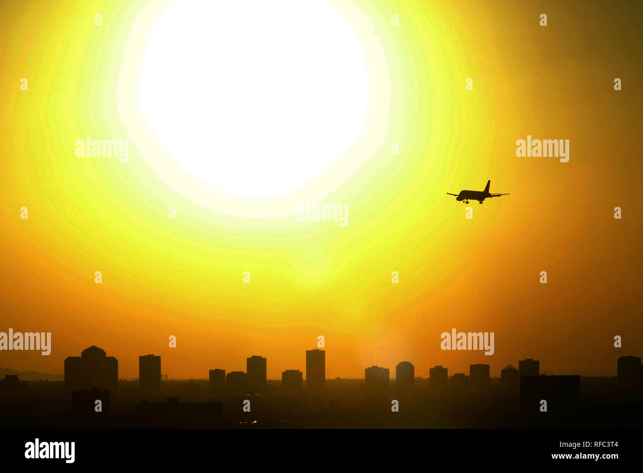 An airplane flies in the sky Stock Photo - Alamy