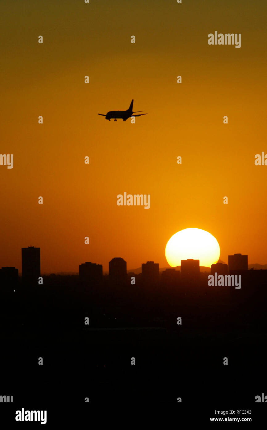 An airplane flies in the sky Stock Photo - Alamy