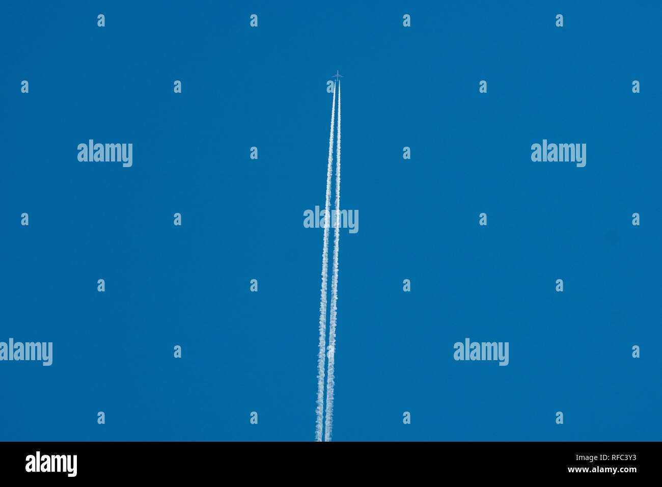 An airplane flies in the sky Stock Photo - Alamy
