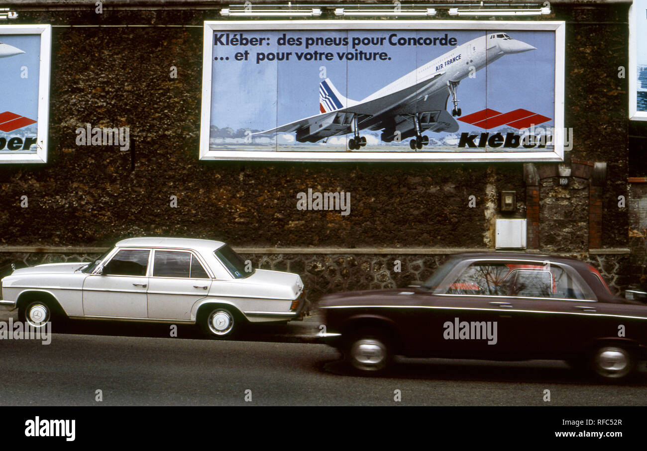 Billboard advertising tires for Concorde SST plane in the streets of Paris, France circa 1970s Stock Photo