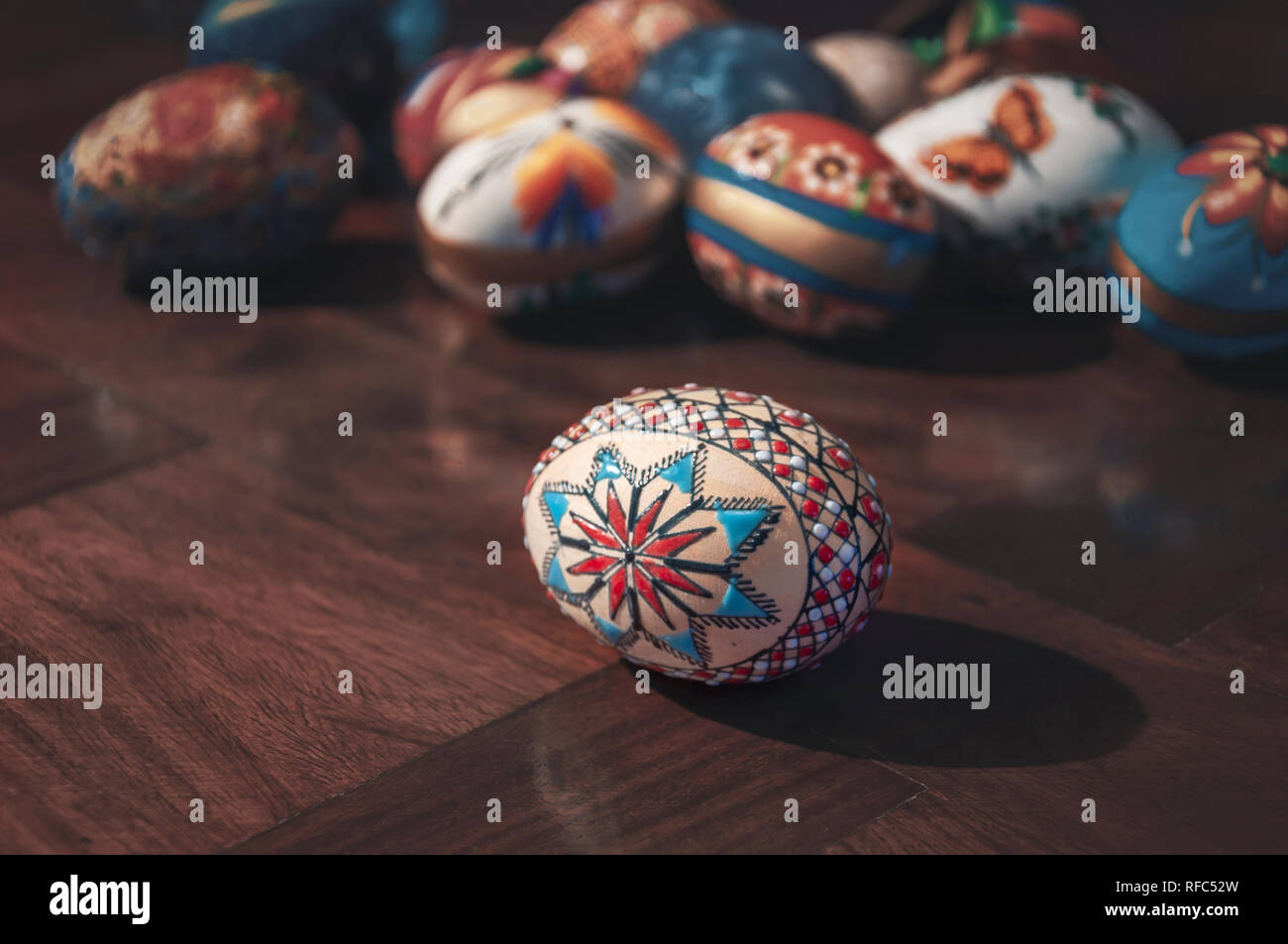 Painted colorful easter eggs on wooden table Selective focus Stock Photo