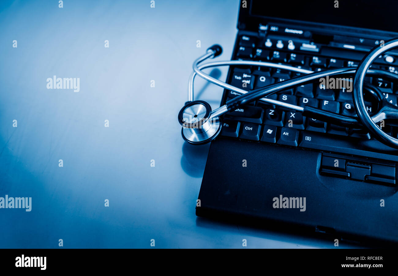 Electronic medical, stethoscope on PC/Laptop/Keyboard， blue toned ...