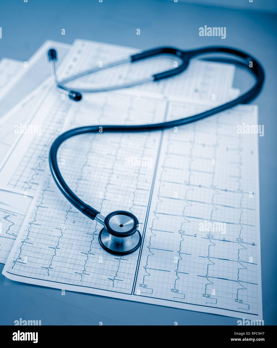 Stethoscope on cardiogram concept for heart care on the desk Stock