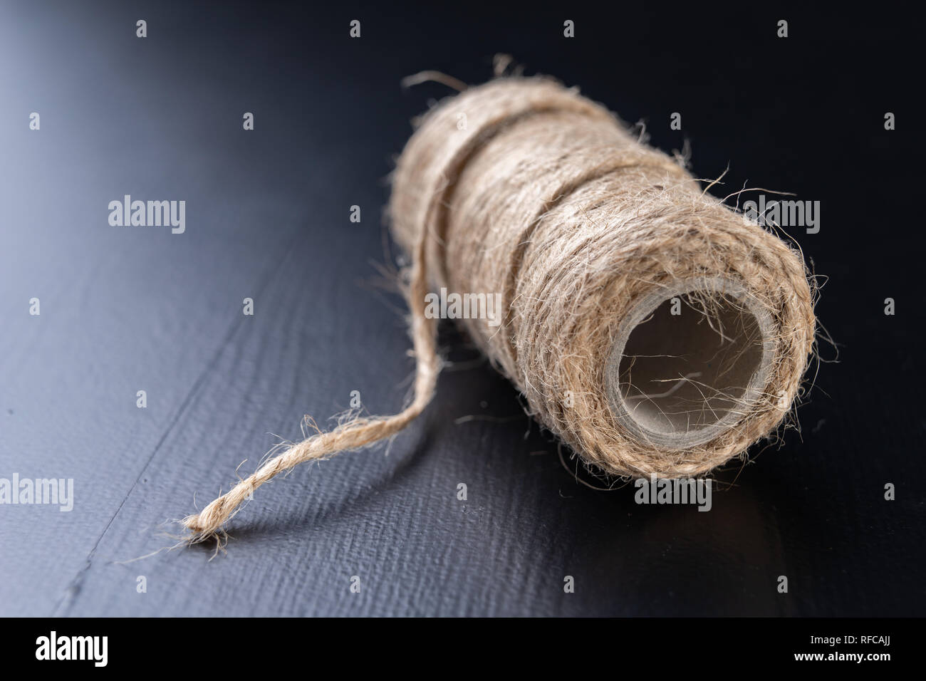 Twine for wrapping packages on the table. Jute string wrapped around