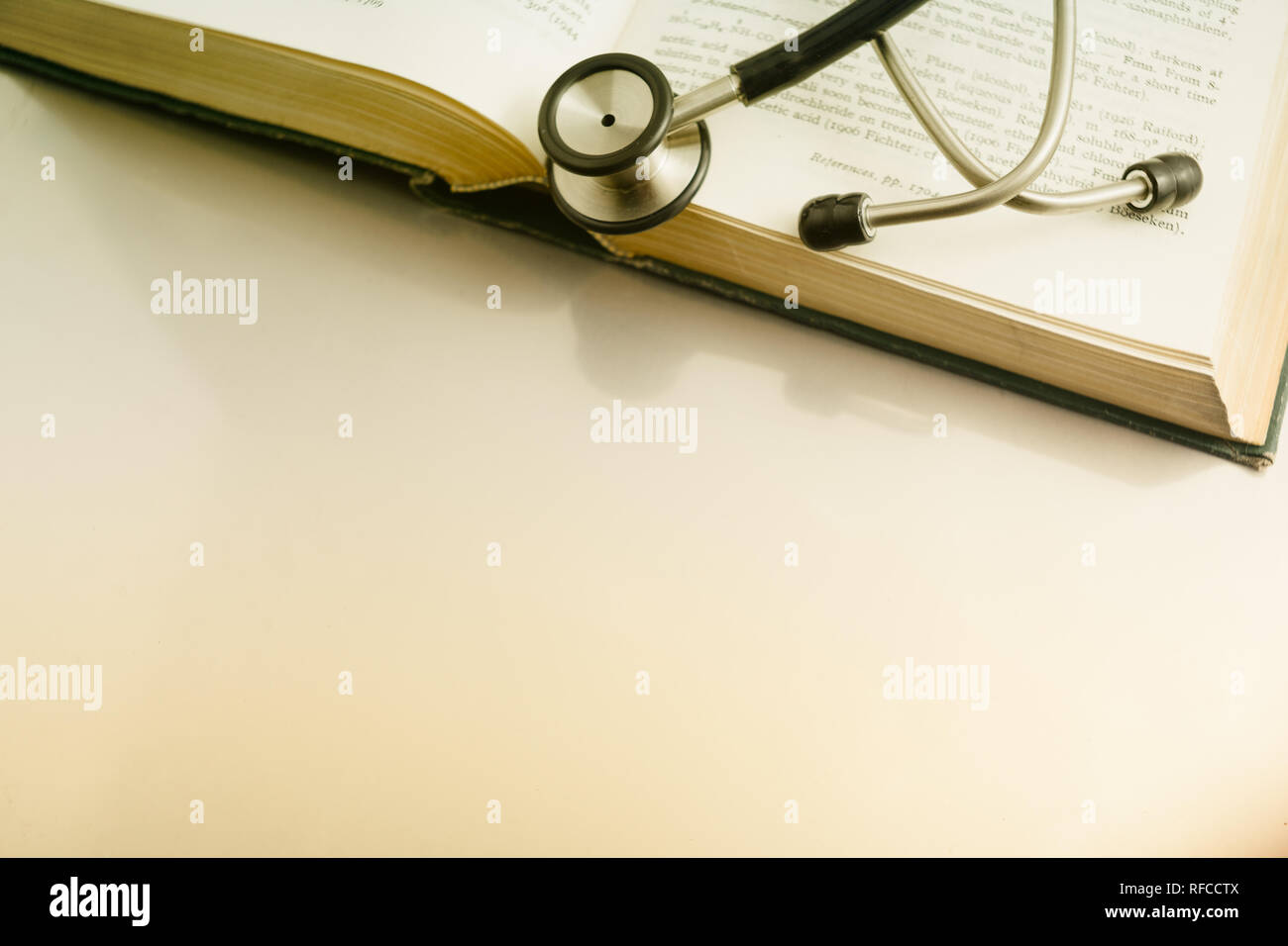 stethoscope and books on white background. Stock Photo