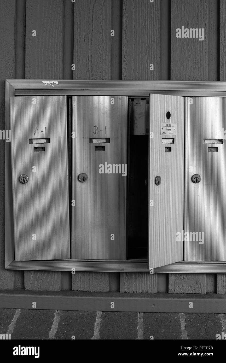 Black and white mailboxes broken into Stock Photo Alamy