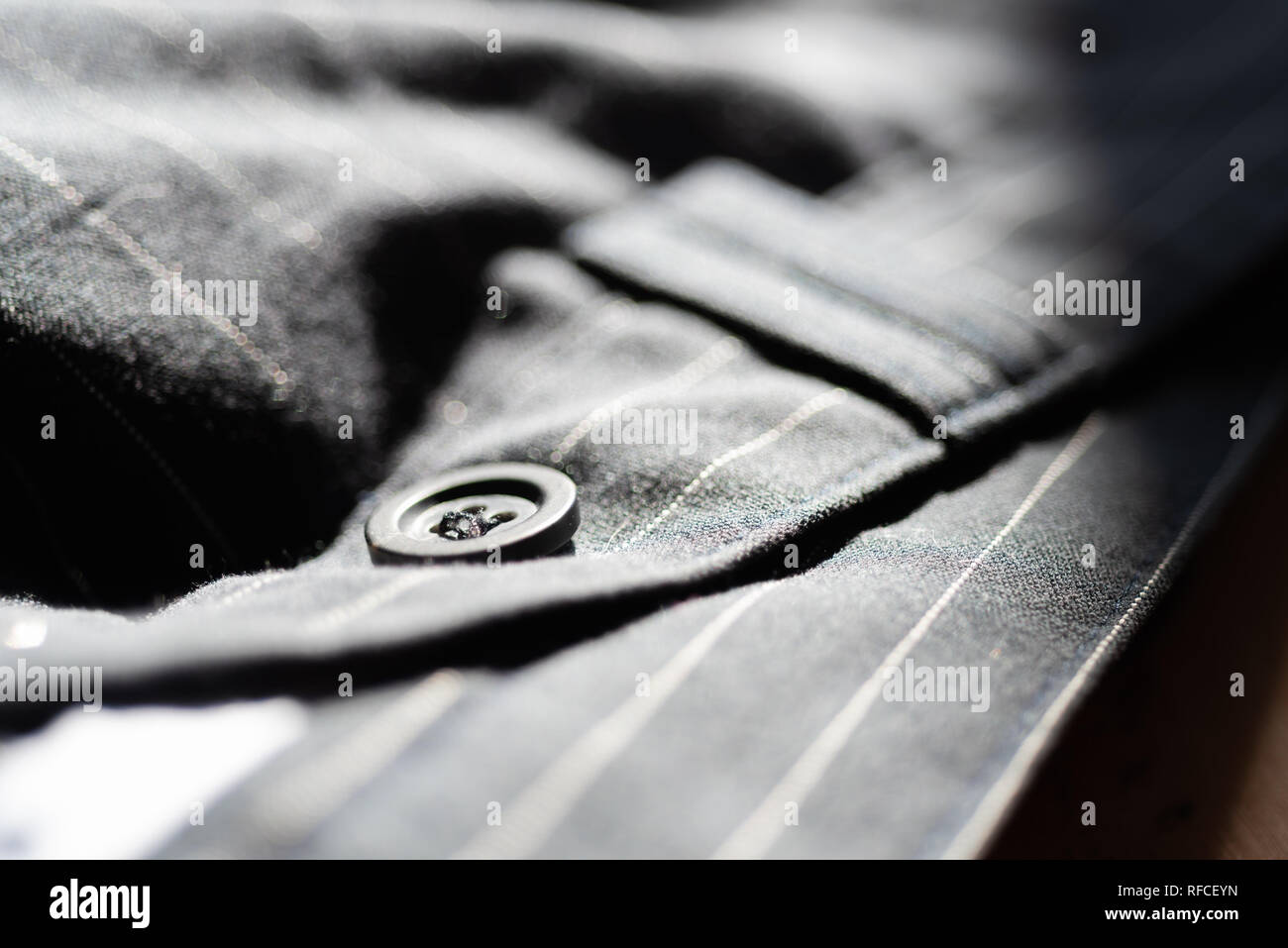 Black button on trousers Stock Photo